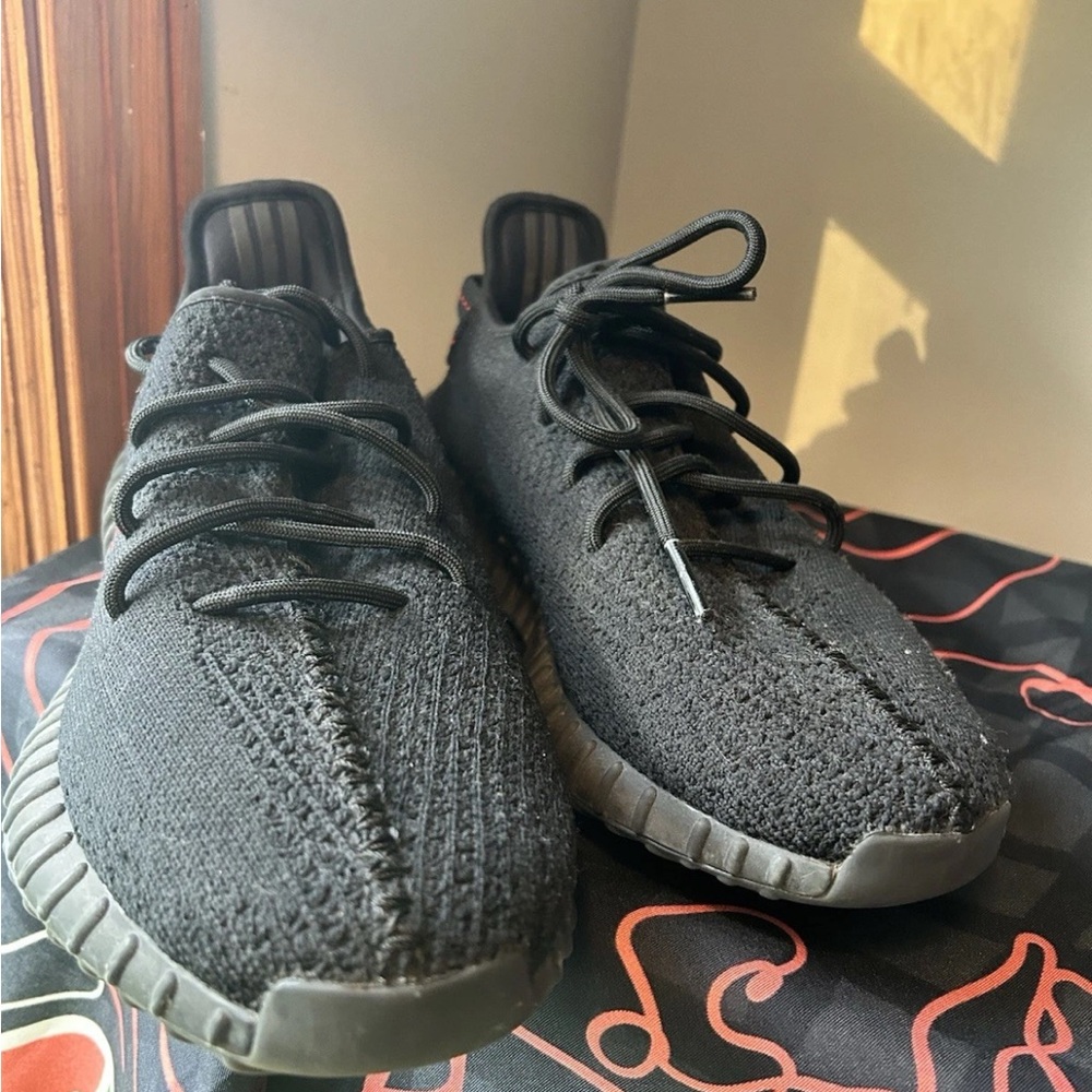 Yeezy Black Athletic Shoes with Knit Upper and Ridged Sole